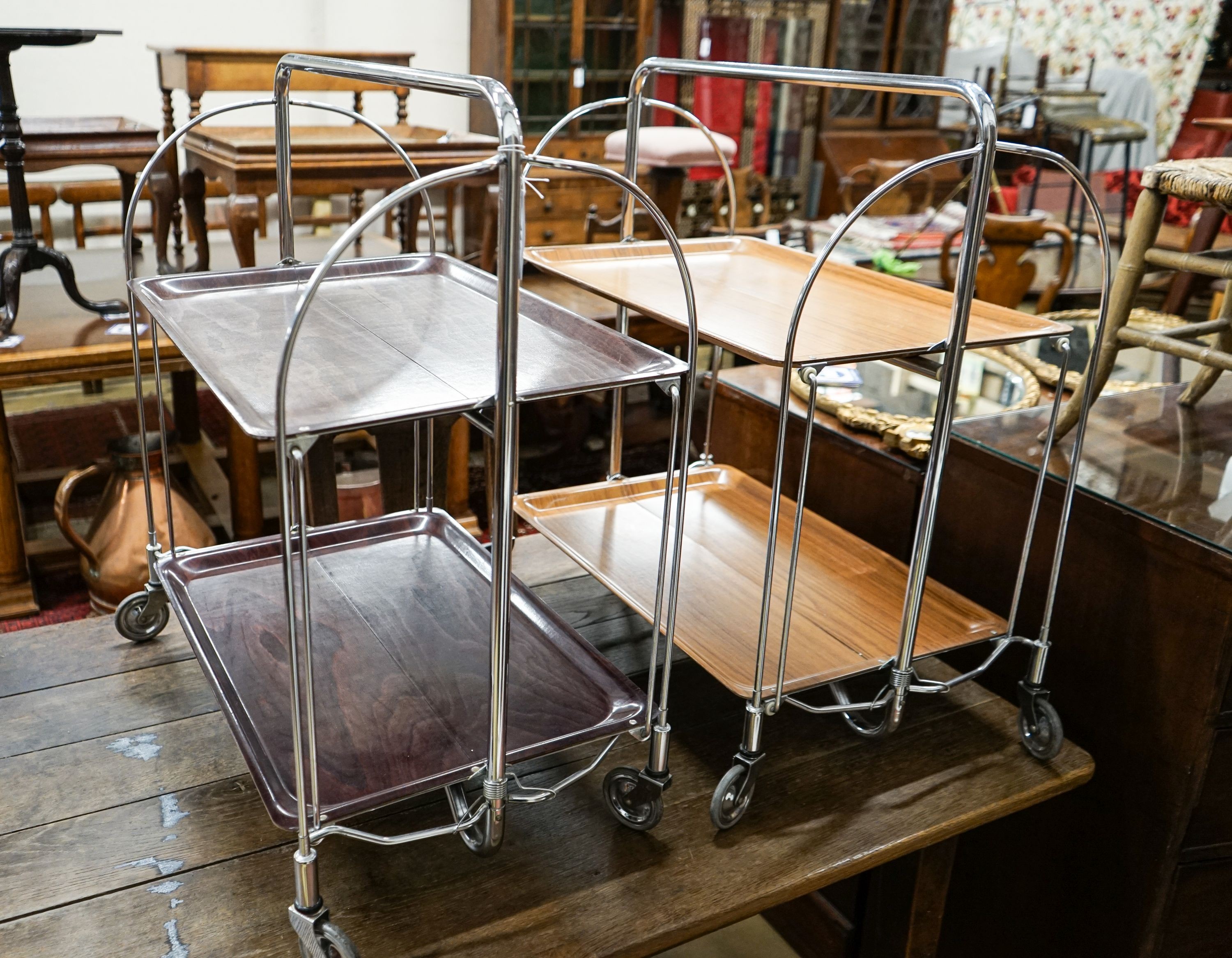 Two mid century Gerlinol Breshley Dinett chrome folding tea trolleys, length 66cm, depth 41cm, height 78cm